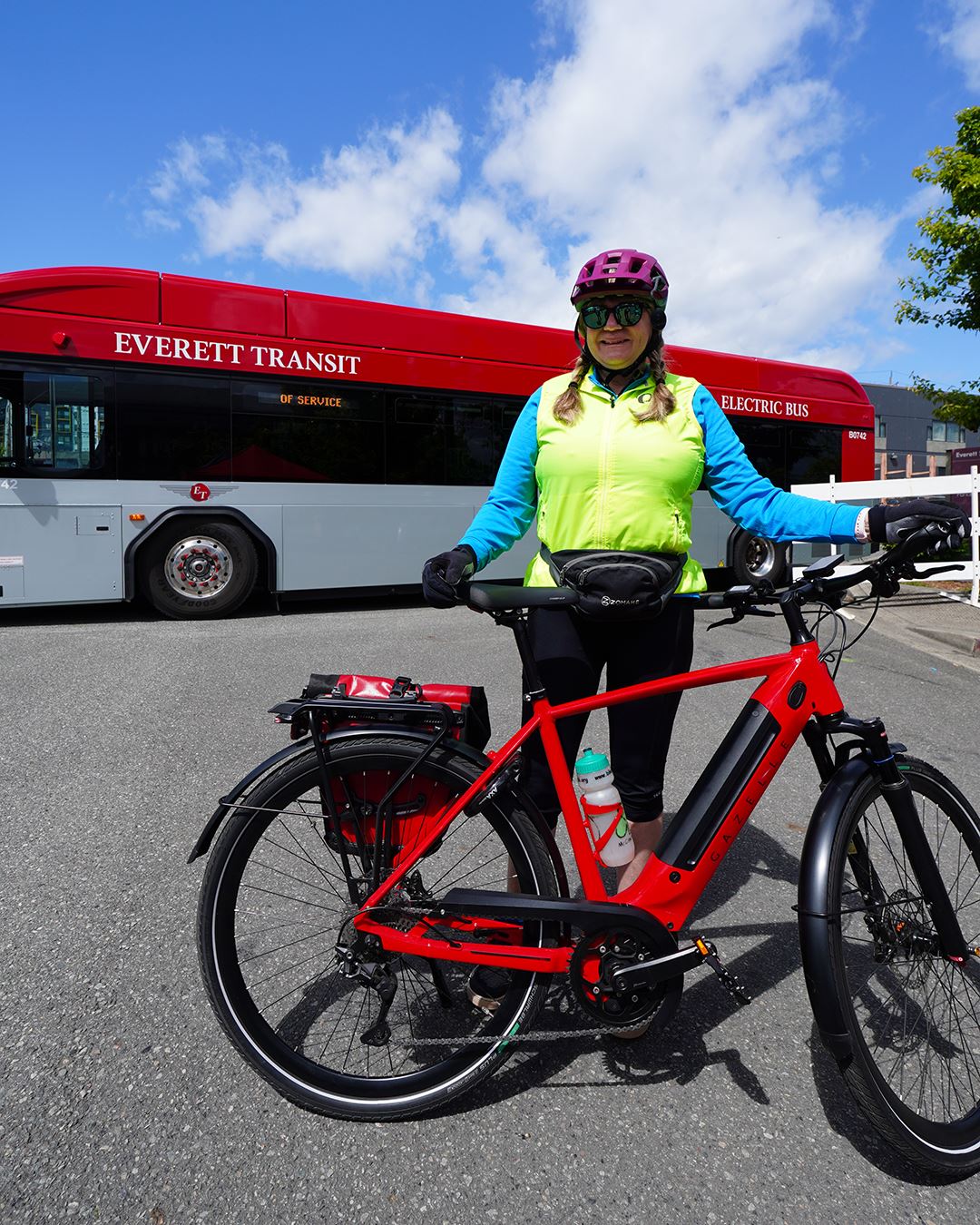 Woman with ebike and ET bus